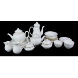 ROYAL WORCESTER, A LARGE AND EXTENSIVE TEA AND COFFEE SERVICE Comprising a tea and coffee pot,