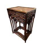 A NEST OF FOUR CHINESE EARLY 20TH CENTURY HARDWOOD TABLES Having rectangular tops and pierced