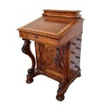A VICTORIAN BURR AND FIGURED WALNUT DAVENPORT DESK Having a brown leather surface, fitted