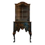 A QUEEN ANNE STYLE CHINOISERIE DECORATED CABINET ON CHEST with glazed doors above an arrangement
