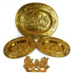 AN 18TH/EARLY 19TH CENTURY BRASS OVAL CHARGER Embossed with a Medieval battlefield, along with two