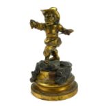 A 19TH CENTURY FRENCH GILT BRONZE CARICATURE FIGURE, CLIMBING MUSKETEER In period clothing with