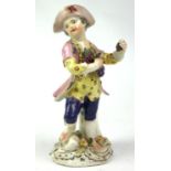 DERBY, AN 18TH CENTURY PORCELAIN MODEL, A YOUNG BOY HOLDING GRAPES Painted in pastel polychrome