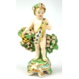 CHELSEA DERBY, A SMALL 18TH CENTURY PORCELAIN FIGURE OF A CHERU HOLDING A BASKET OF FLOWERS,