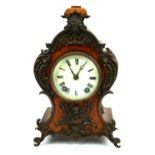 LENZKIRCH, A LATE 19TH CENTURY CONTINENTAL WALNUT ROCOCO FORM MANTEL TIMEPIECE Ormolu surmounted