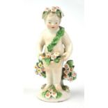 CHELSEA DERBY, A SMALL 18TH CENTURY PORCELAIN STANDING FIGURE OF A CHERUB, PUTTO, CIRCA 1750 -