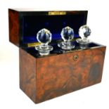 A FINE LATE VICTORIAN ROSEWOOD CASED THREE PIECE SPIRIT DECANTER BOX AND COVER Containing three