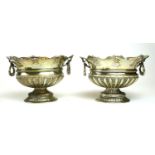 A PAIR OF 19TH CENTURY CONTINENTAL SILVER SWEETMEAT BASKETS Having twin handles, a scrolled and