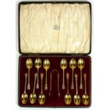 A SET OF TWELVE EARLY 20TH CENTURY SILVER GILT TEASPOONS Each with Tudor rose to finials, hallmarked