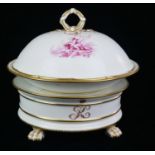 A 19TH CENTURY PORCELAIN ARMORIAL CAKE STAND Raised on four gilded paws, decorated with a crown with