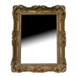 A 19TH CENTURY GILT FRAMED MIRROR With shell sectioned and foliage frame. (92cm x 110cm)