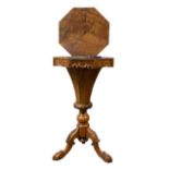 A VICTORIAN BURR AND FIGURED WALNUT TRUMPET FORMED SEWING TABLE The octagonal rise and fall top