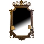 A 19TH CENTURY GIRONDELLE MIRROR With scrolling crest centered with a rams head above ogee shaped