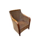 A BEECHWOOD AND RATTAN COLONIAL STYLE ARMCHAIR. (74cm x 67cm x 88cm) Condition: some very light