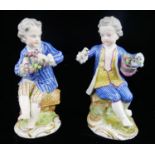 MEISSEN, A PAIR OF MID 19TH CENTURY PORCELAIN FIGURES, 18TH CENTURY STYLE BOYS IN BLUE JACKETS