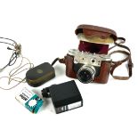 A VINTAGE TAN LEATHER CASED PERIFLEX 3 CAMERA Complete with accessories. Condition: showing signs of