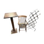 A VICTORIAN CHILD'S COMMODE CHAIR Along with an iron wine rack and an adjustable oak table.