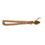 A VICTORIAN 9CT ROSE GOLD BRACELET Having uniform pierced links, fastened with later heart form