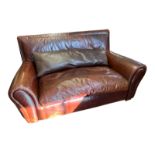 FENDI, A TAN LEATHER UPHOLSTERED TWO SEAT SETTEE Complete with loose cushions, bearing brand name.