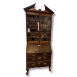 A 19TH CENTURY MAHOGANY BUREAU BOOKCASE With astragal glazed doors above a fall front writing
