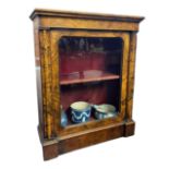 A VICTORIAN WALNUT AND MARQUETRY INLAID PIER CABINET The single glazed door having velvet lined