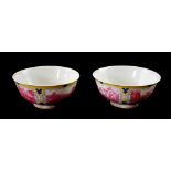 A PAIR OF CHINESE EXPORT PORCELAIN BOWLS Both enamelled with four pink and yellow cartouche panels