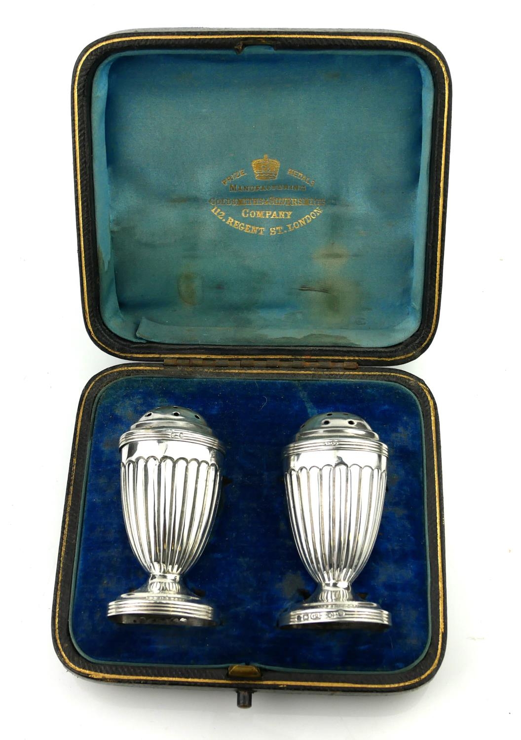 A PAIR OF VICTORIAN SILVER PEPPERETTES Having pierced dome tops and flutes to body, hallmarked