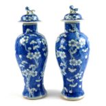 A PAIR OF EARLY 20TH CENTURY BLUE AND WHITE CHINESE EXPORT PORCELAIN BALUSTER VASES AND COVERS