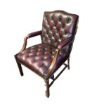 A GAINSBOROUGH DESIGN OXBLOOD BUTTON BACK LEATHER UPHOLSTERED OPEN ARMCHAIR. Condition: dusty - in