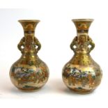 A PAIR OF FINE JAPANESE SATSUMA MEIJI PERIOD, 1868 - 1911, EARTHENWARE VASES Twin handled vases