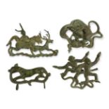 FOUR ARCHAIC STYLE PIERCED BRONZE PLAQUES, ANIMAL AND HUMAN SUBJECTS. (longest 17cm)
