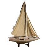 A VINTAGE WOODEN HULL POND YACHT On stand Condition good w 65cm x h 88cm