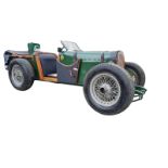 A HAND BUILT VINTAGE STYLE OPEN TOP SIT IN BENTLEY CAR In racing green and with pine show wood coach