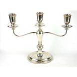 A 20TH CENTURY SILVER CANDELABRA Having two branch arms and circular base, hallmarked Birmingham,