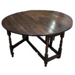 AN 18TH CENTURY OAK GATE LEG OVAL DINING TABLE Raised on square and turned legs. (120cm x 43cm x