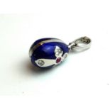 FABERGÉ, A LIMITED EDITION (192/1000) 18CT WHITE GOLD, RUBY, DIAMOND AND BLUE ENAMEL PENDANT In