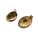 AN EARLY 20TH CENTURY 9CT GOLD OVAL LOCKET With engraved decoration of a bird with fauna, together