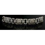 AN IMPRESSIVE ART DECO DESIGN 18CT WHITE GOLD AND DIAMOND BRACELET The arrangement of round cut