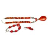 A COLLECTION OF VINTAGE WHITE METAL AND CARNELIAN JEWELLERY Comprising a pendant necklace,