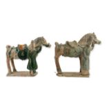 A PAIR OF MING STYLE SANCAI POTTERY HORSE AND GROOM GROUPS. (h 27cm)