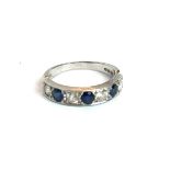 A VINTAGE 18CT WHITE GOLD, SAPPHIRE AND DIAMOND HALF ETERNITY RING Three round cut sapphires