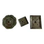 TWO ROUND ARCHAISTIC BRONZE MIRRORS Along with a square mirror and an oblong mirror. (largest w