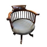 MAPLE AND CO., A LATE VICTORIAN MAHOGANY CAPTAIN'S CHAIR With overstuffed upholstered seat,