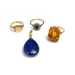 A VINTAGE 9CT GOLD AND LAPIS LAZULI PENDANT The pear cut stone with plain gold bale, together with