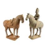 A TANG STYLE POTTERY HORSE AND A POTTERY HORSE AND RIDER. (length 30cm)