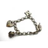 LINKS OF LONDON, A SILVER CHARM BRACELET Hung with a heart, frog and letter 'M'. (18cm) Condition: