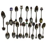 A COLLECTION OF NINETEEN SILVER ARMORIAL SPOONS, majority being British hallmarked. Gross weight-