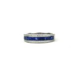 AN 18CT WHITE GOLD, SAPPHIRE AND DIAMOND HALF ETERNITY RING. (Sapphires 1.41ct, Diamonds 0.35ct)