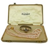 A 9CT GOLD CASED WRISTWATCH Together with a multi strand simulated pearl necklace, fastened with a