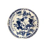 A 18TH CENTURY CHINESE BLUE AND WHITE PLATE Having a brown outer rim, lotus flower and bamboo